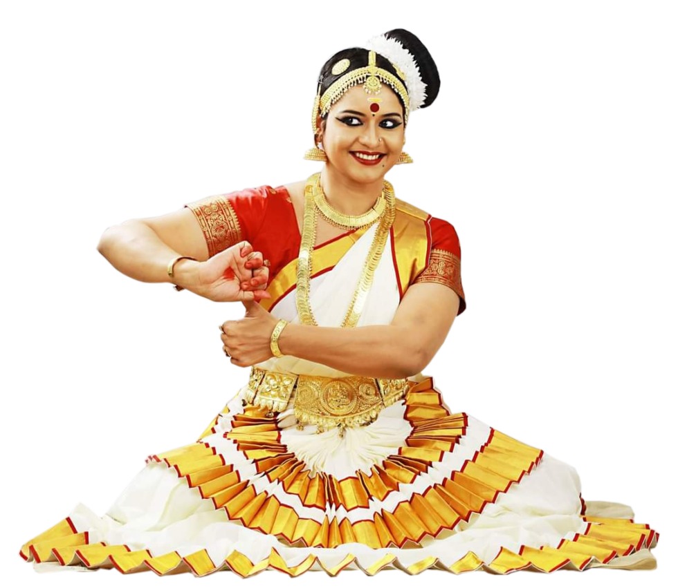 A woman in a traditional white and gold Indian classical dance costume, posing gracefully.
